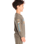 Side view of boy wearing Chaser’s Safari Green Champions Racing Team long sleeve top with matching pants on a white background