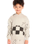 Boy wearing Chaser’s Blocked Checkered Bolts light gray hoodie with black and white checkered pattern and lightning bolt designs on a white background