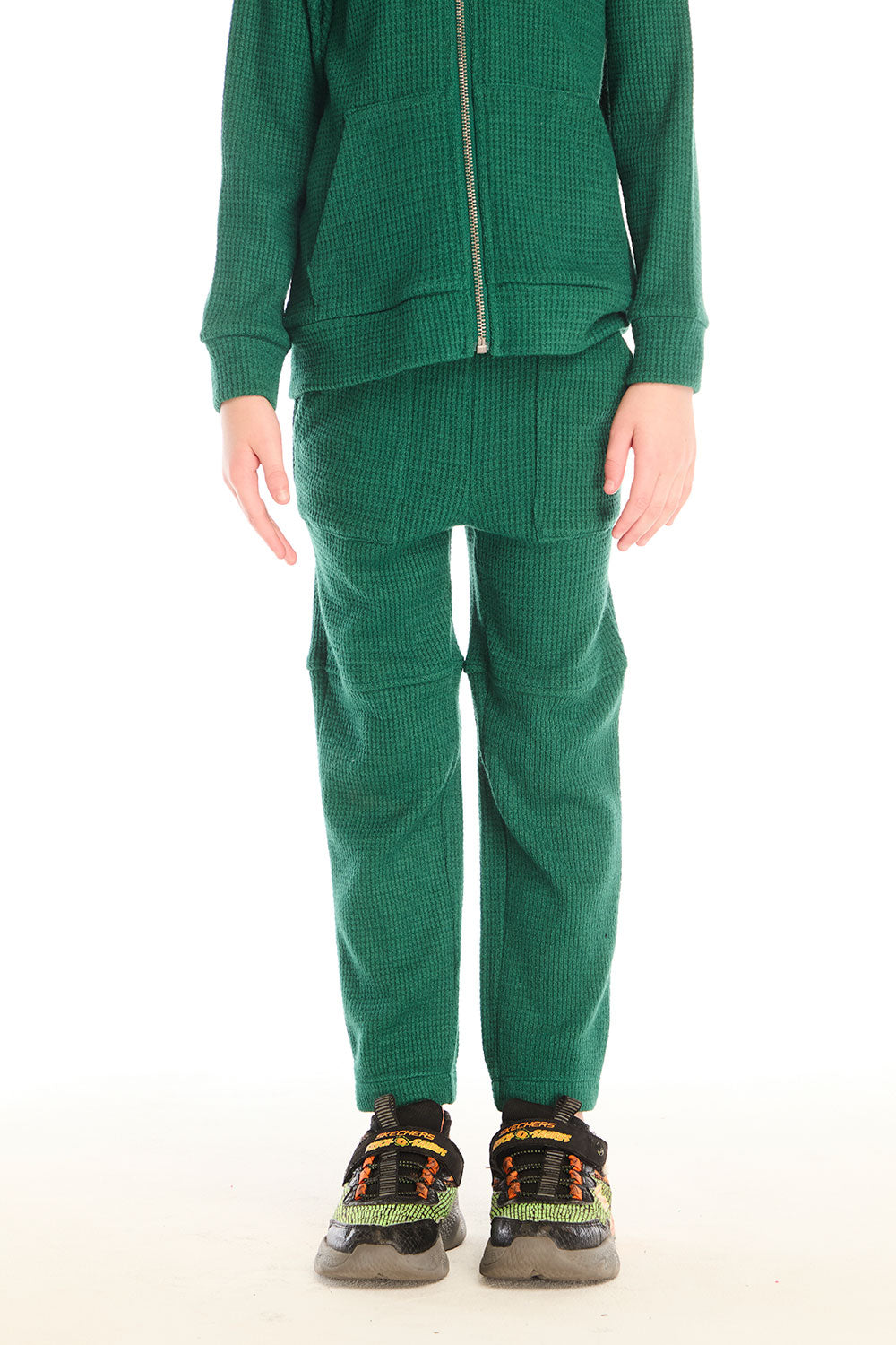 Front view of boy wearing Chaser’s Everest Green Knee Seam Jogger with knee seam detail on a white background