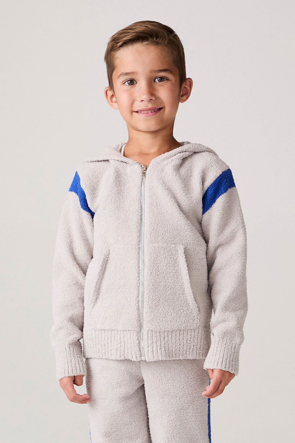 Model wearing Chaser's Sporty Colorblock Boys Zip-Up Hoodie in heather grey with colorblock detailing, front view