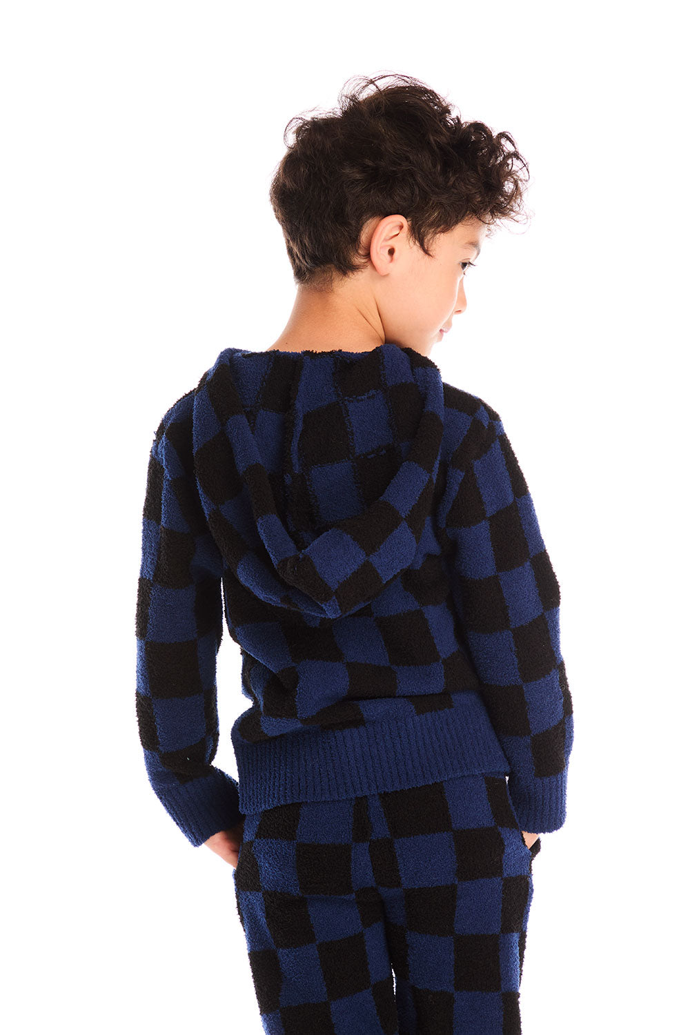 Back view of boy wearing Chaser’s Paxton blue and black checkered zip up hoodie with matching pants on a white background