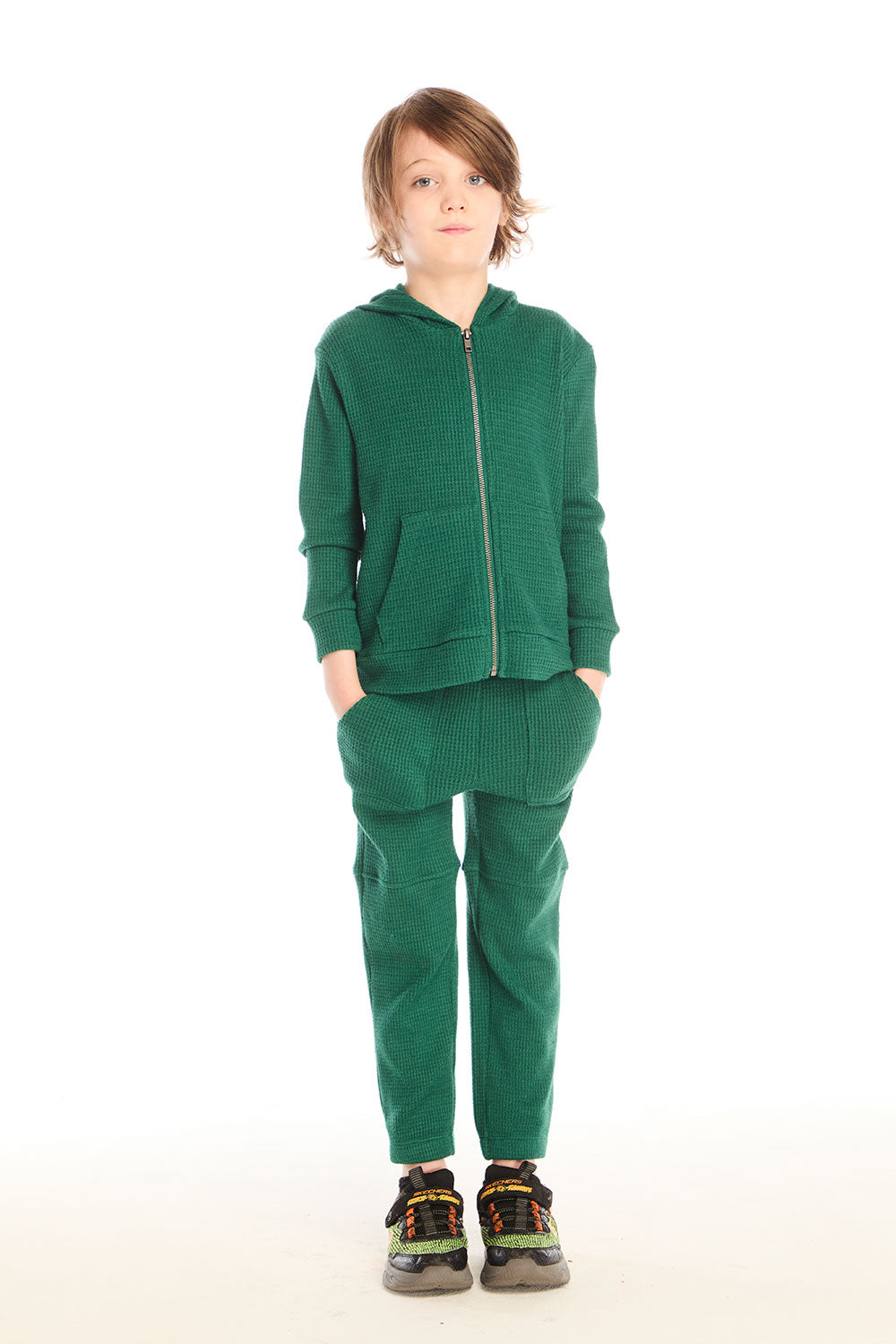 Full body front view of boy wearing Chaser’s Everest Green Zip Up Hoodie with matching Everest Green Knee Seam Joggers on a white background