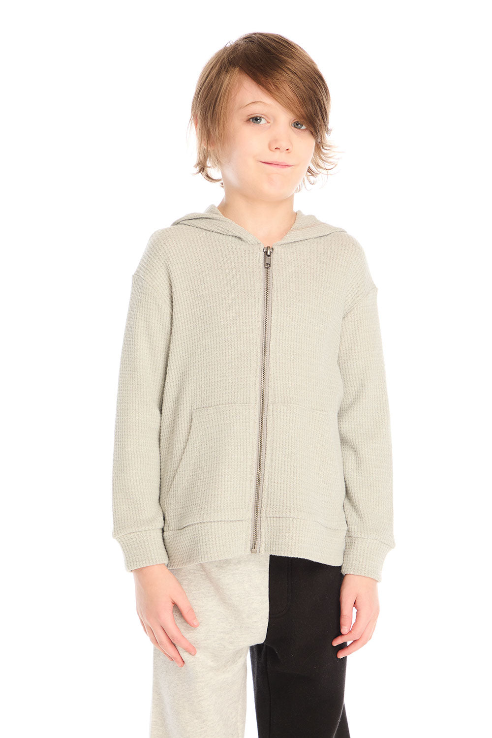 Front view of boy wearing Chaser’s Heather Grey Zip Up Hoodie with waffle texture against a white background