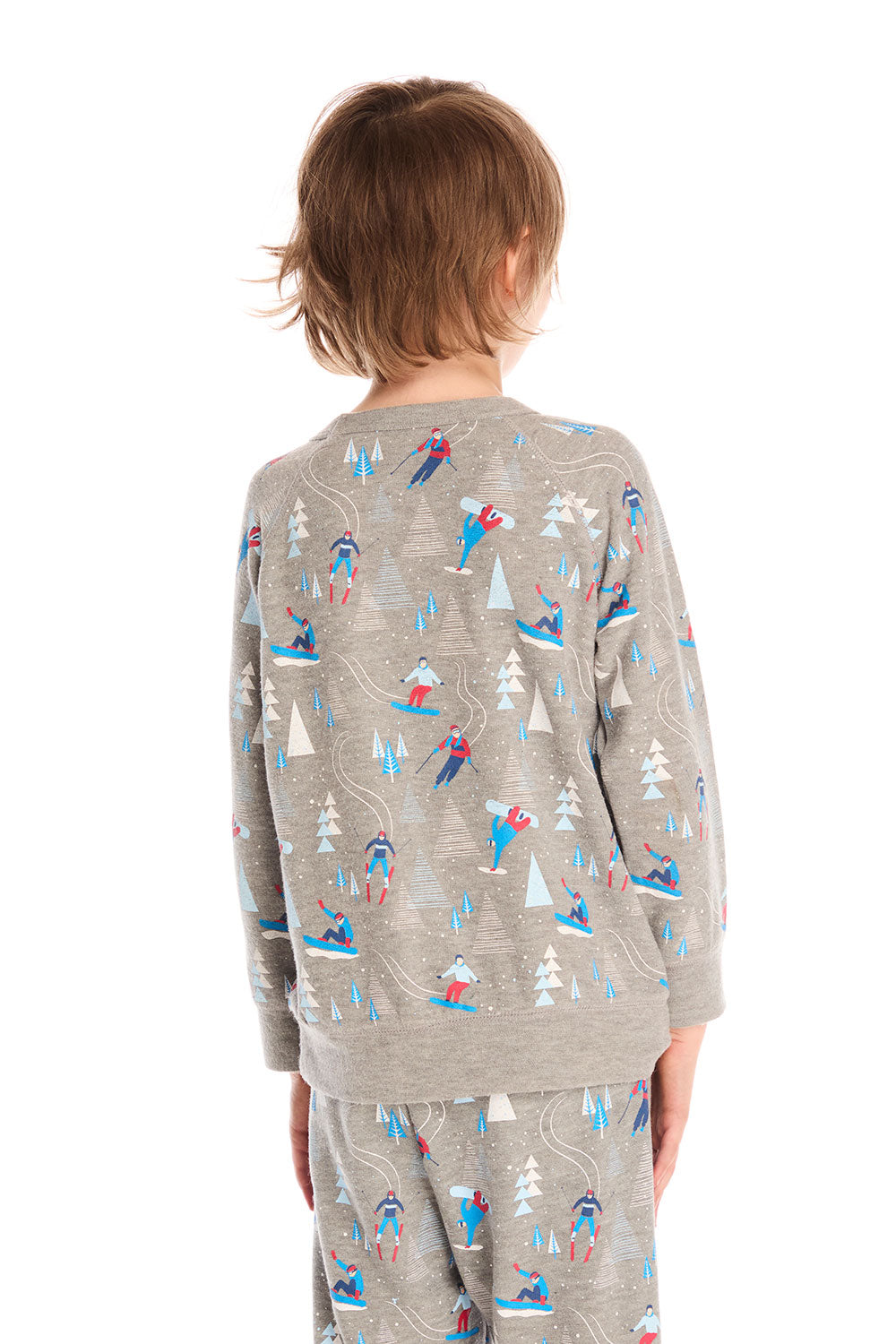Back view of boy wearing Chaser's gray Allover Ski Slope long sleeve and matching pant with colorful patterns on a white background
