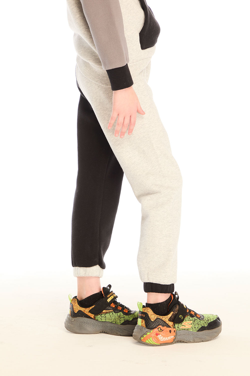 Side view of boy wearing Chaser’s Colorblocked Lounge Pant with clean silhouette and relaxed fit on a white background