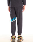 Back view of boy wearing Chaser’s Avalon Lounge Pant with blue stripe strappings against a white background