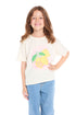 Girl wearing the Chaser Kids Lemonade Amore Tee featuring a vintage white color with a bright lemon graphic and “Amore Della Limonata” text