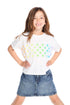 Girl wearing the Chaser Kids Glitter Stars Tee featuring a rainbow gradient star pattern across the front on a soft white background