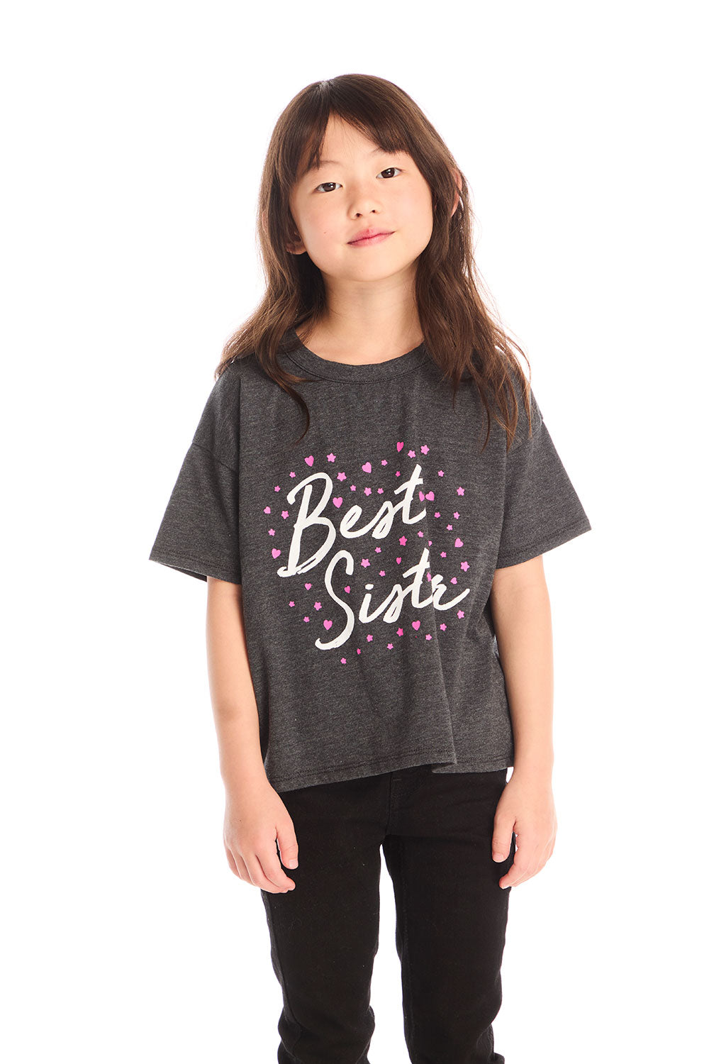 Young girl wearing Chaser’s Best Sister black tee on a white background