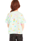 Back view of girl wearing Chaser’s light green Unicorn Hearts Tee on a white background