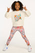 Child wearing a floral sweatshirt and leggings on a white background