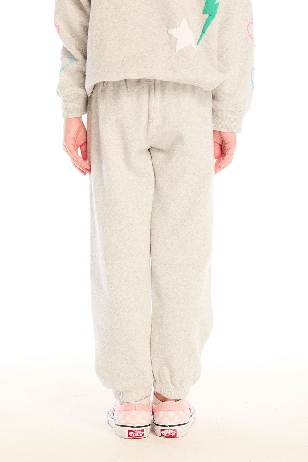 Back view of girl wearing Chaser’s light gray Winter Love Pants on a white background