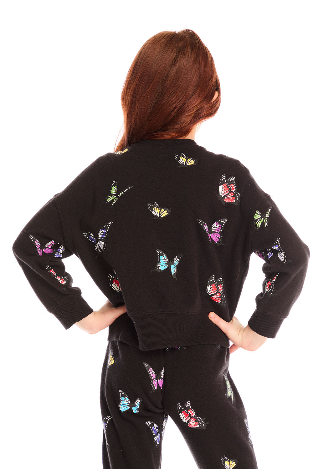 Back view of girl wearing Chaser’s Blondie Leopard & Hearts print pullover top with red text on a white background