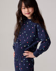 Model wearing Chaser's Festive Lights Girls Pullover in Avalon with distinctive graphic and design details, front view