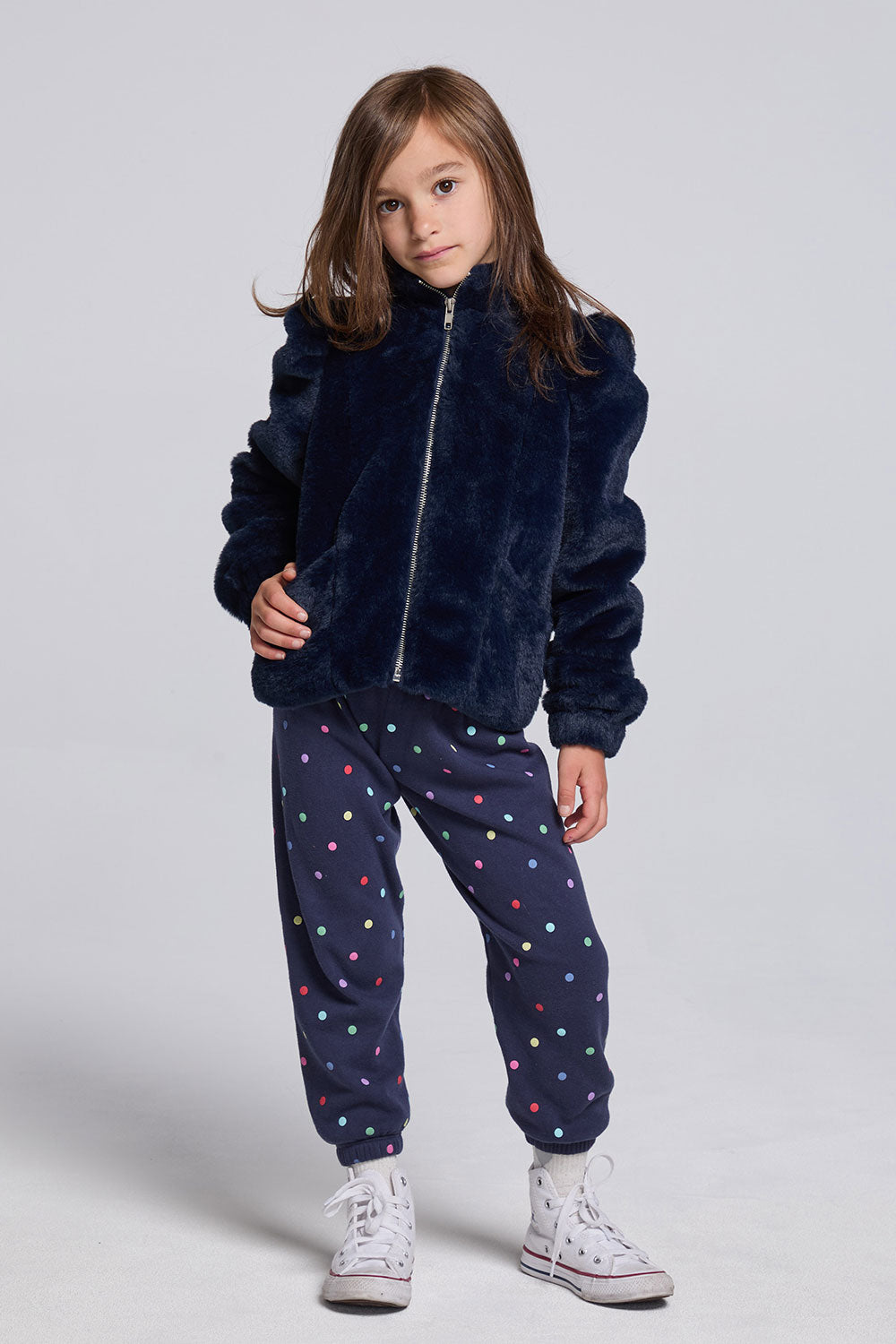 Chaser Kids Avalon Girls Puff-Sleeve Jacket in navy worn with dotted pants, full-body front view against a light gray studio background