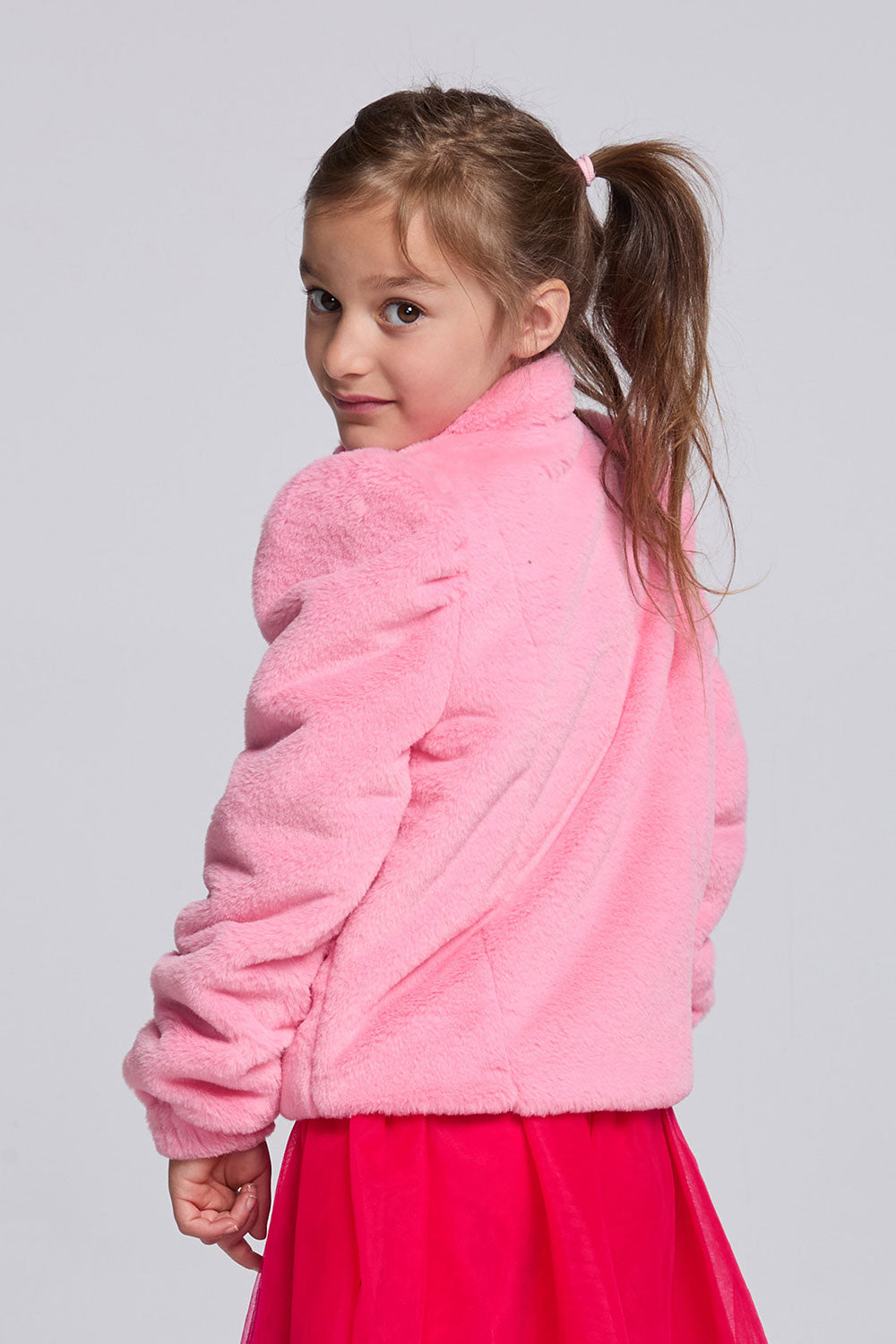 Chaser Kids Camelia Girls Puff-Sleeve Jacket in pink plush fabric, rear three-quarter view against a light gray studio background