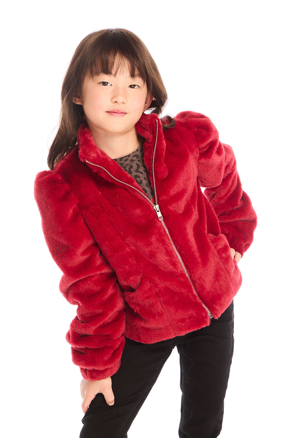 Girl wearing Chaser’s Puff Sleeve Rouge Jacket on a white background