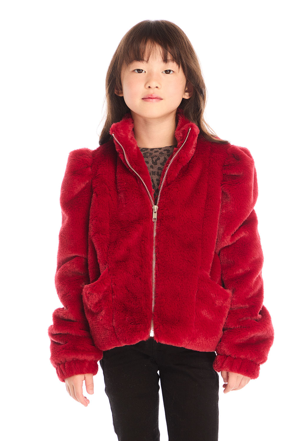 Girl wearing Chaser’s Puff Sleeve Rouge Jacket on a white background