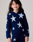 Model wearing Chaser's Allover Stars Girls Hoodie in lake blue with star detailing, front view