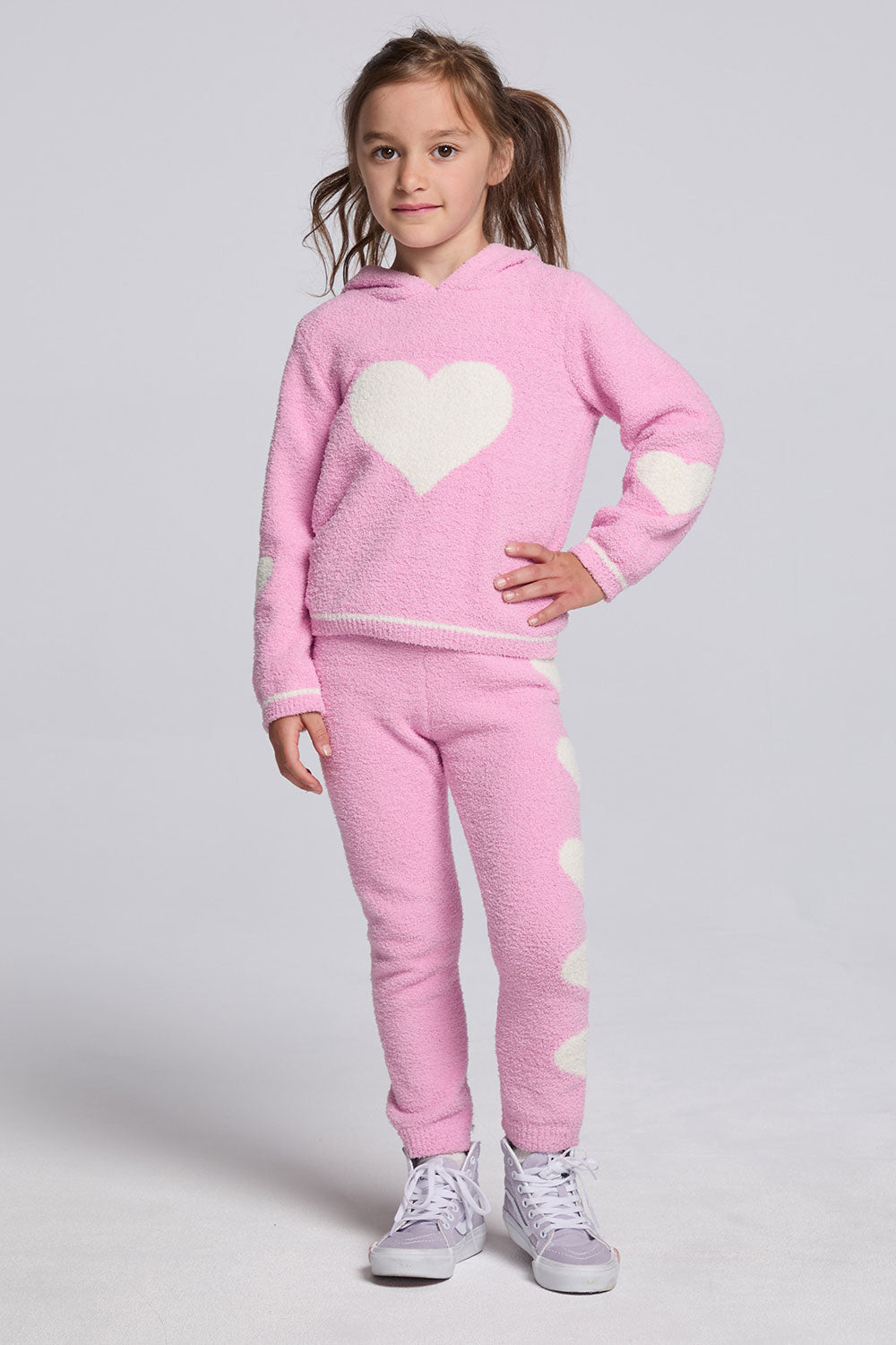 Chaser Kids Holiday Hug Girls Hoodie and Holiday Hug Girls Pants in pink with white hearts, full-body front view against a light gray studio background