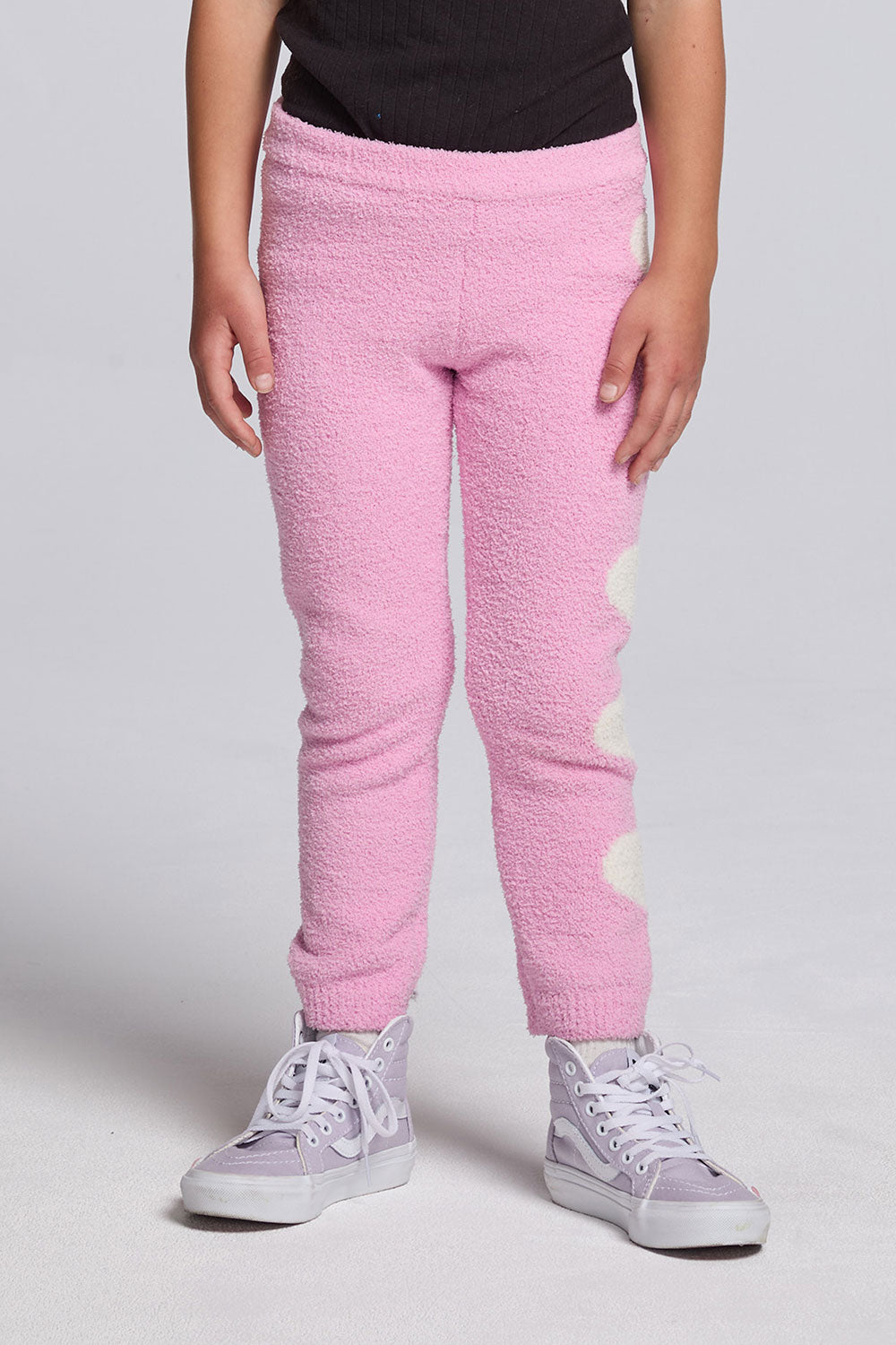 Chaser Kids Holiday Hug Girls Pants in pink with ribbed cuffs, front view on a model against a light gray studio background
