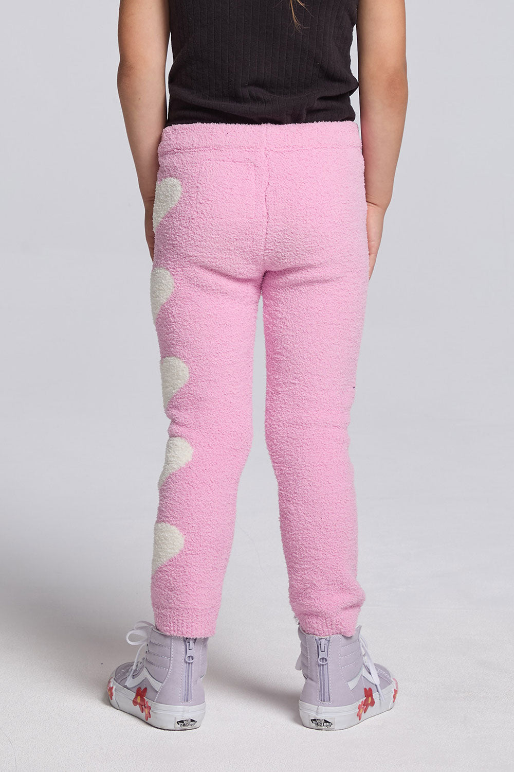 Chaser Kids Holiday Hug Girls Pants in pink, rear view on a model against a light gray studio background