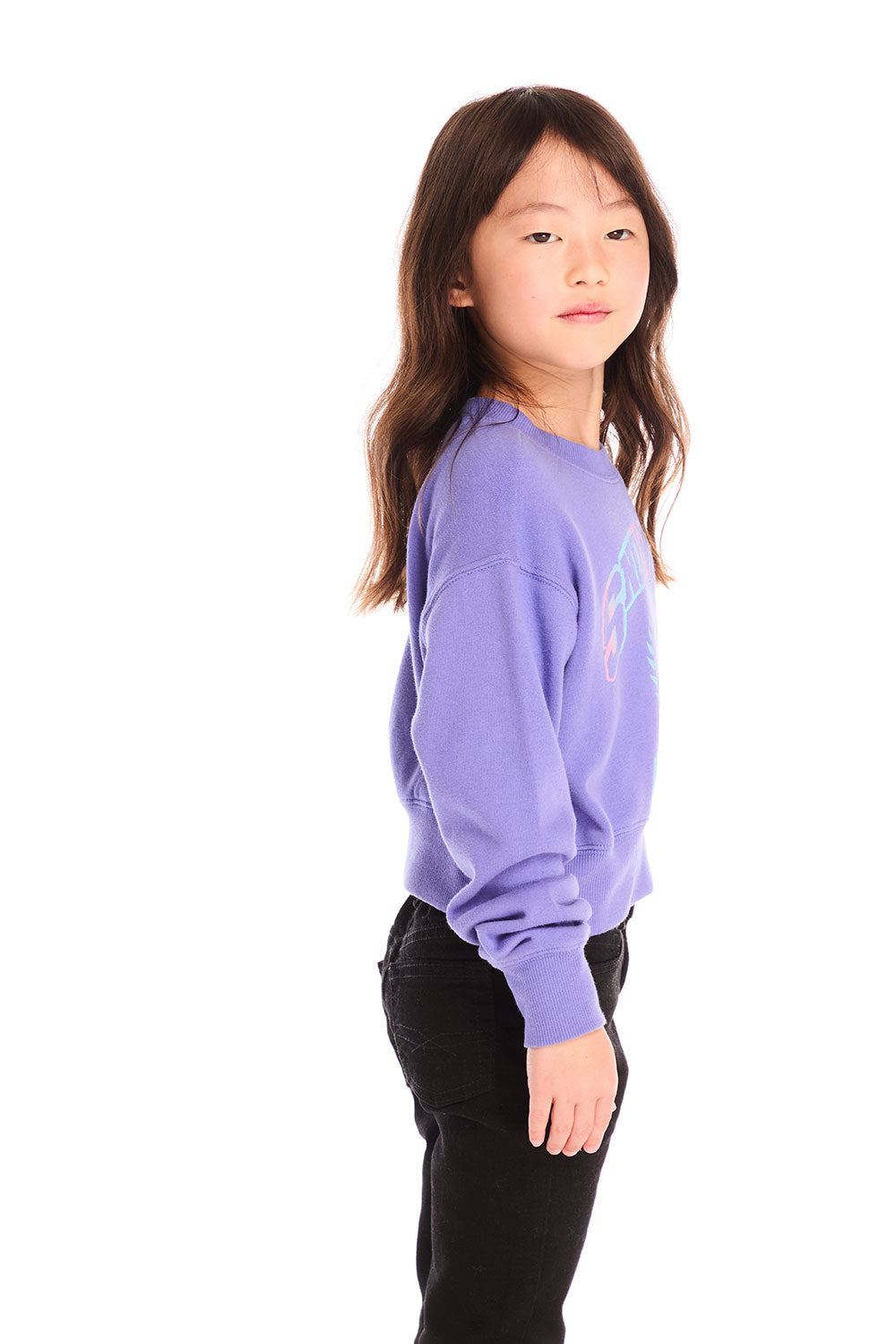 Side view of girl wearing Chaser’s purple Snow Day Athletic Club long sleeve with text and graphics on a white background