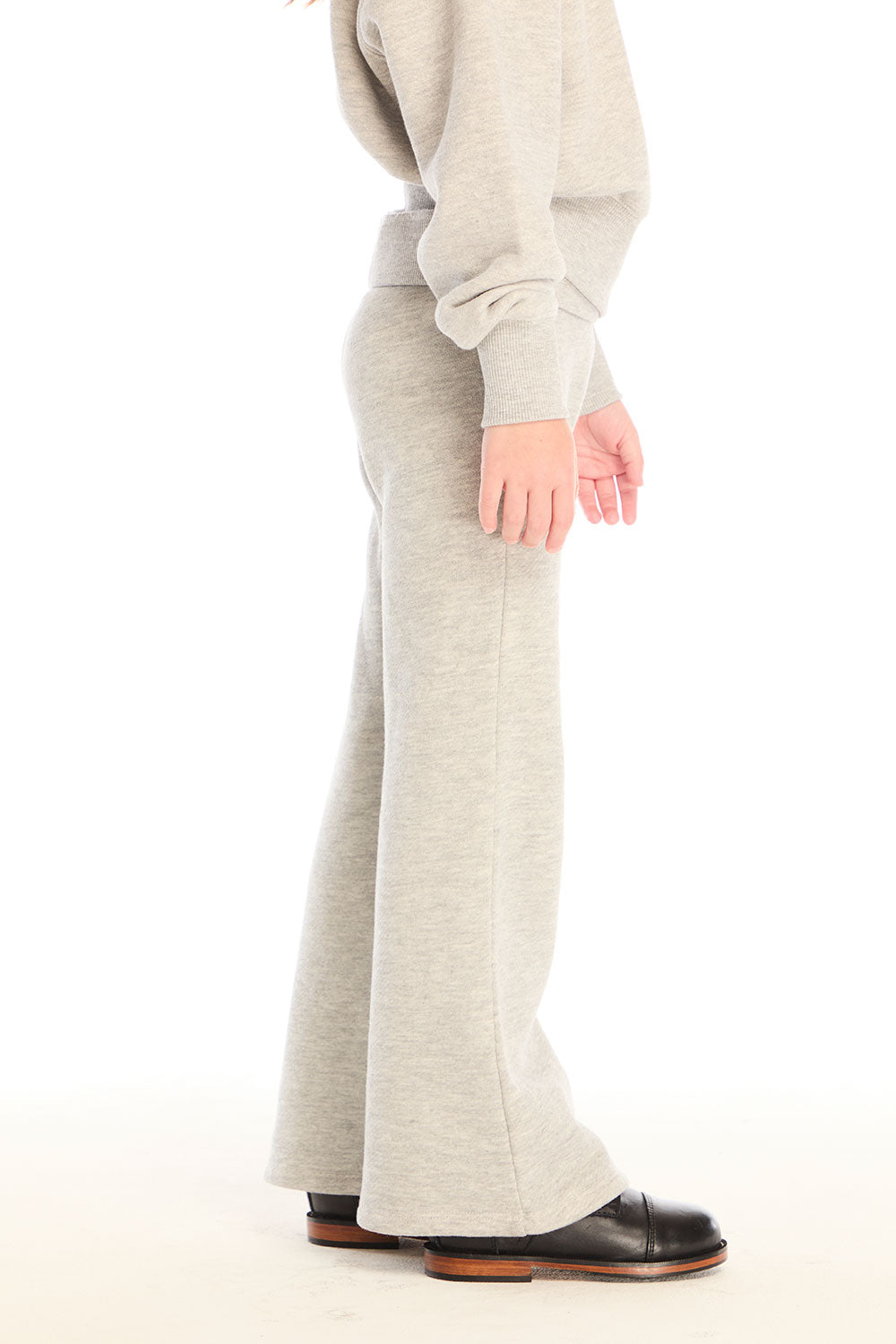 Side view of girl wearing Chaser’s Tara Heather Grey Leggings with matching Danni Pullover on a white background
