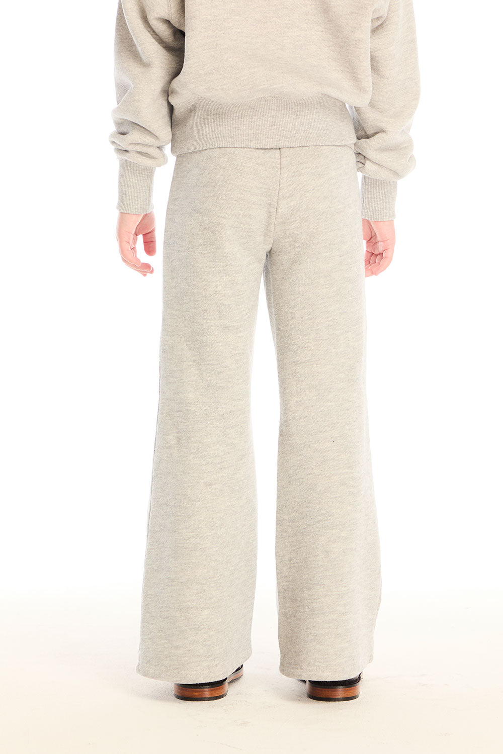 Back view of girl wearing Chaser’s Tara Heather Grey Leggings with matching Danni Pullover on a white background