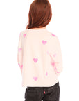 Back view of young girl wearing Chaser’s Allover Hearts light pink pullover with heart patterns on a white background