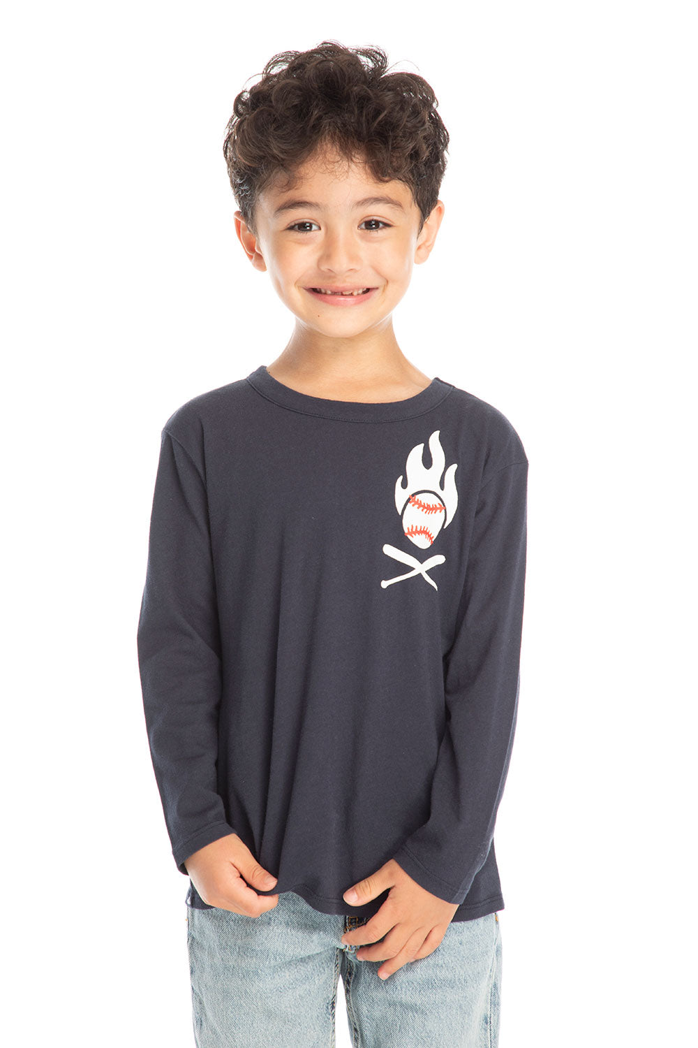 Boy wearing Chaser’s Bring The Heat black long-sleeve shirt with logo, light blue jeans, and brown boots on a white background.