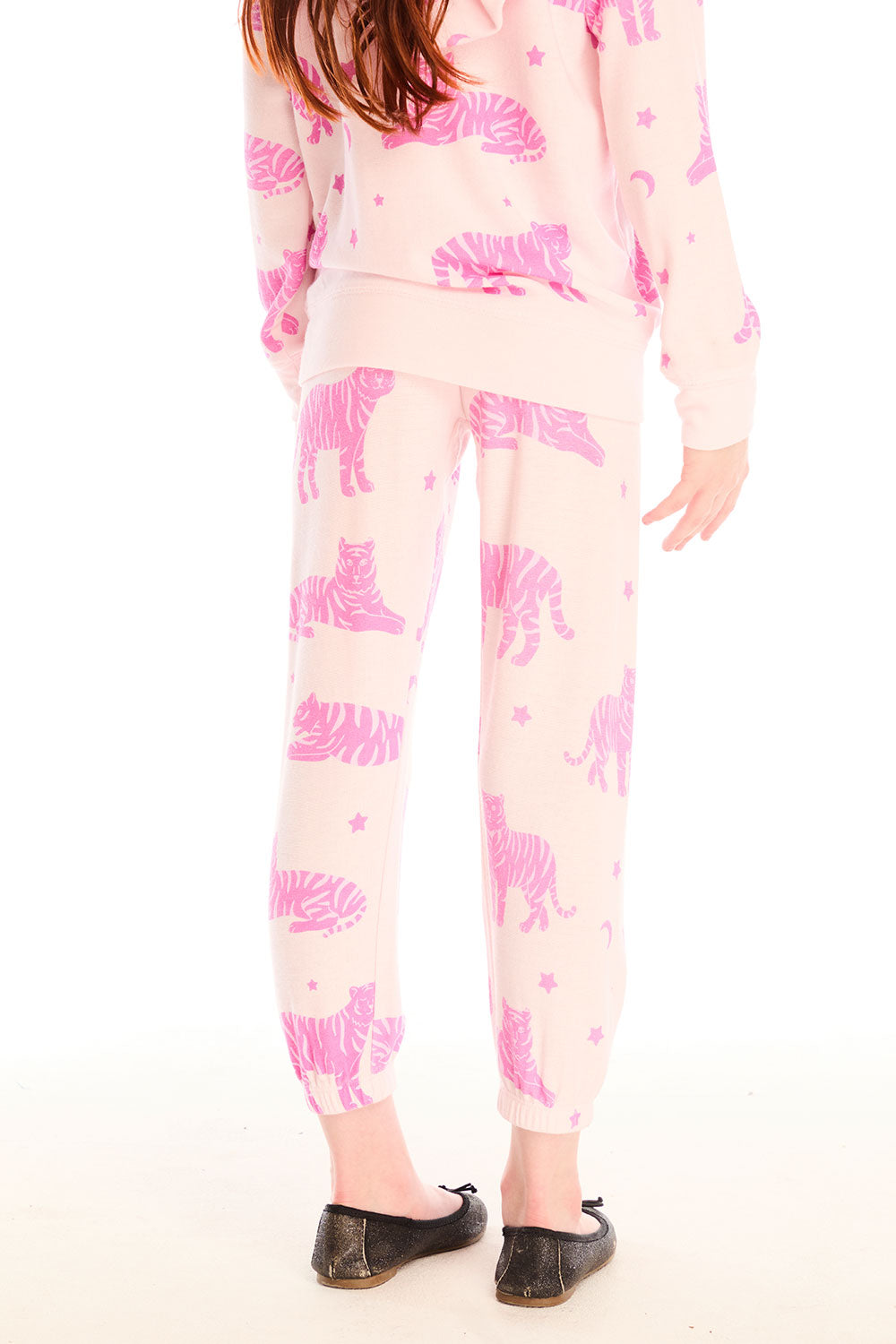Back view of girl wearing Chaser’s Celestial Tigers Sweatpant with pink animal pattern on a white background