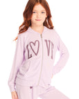 Girl wearing Chaser’s light pink Love Zip Up Hoodie with ‘LOVE’ printed on it against a white background