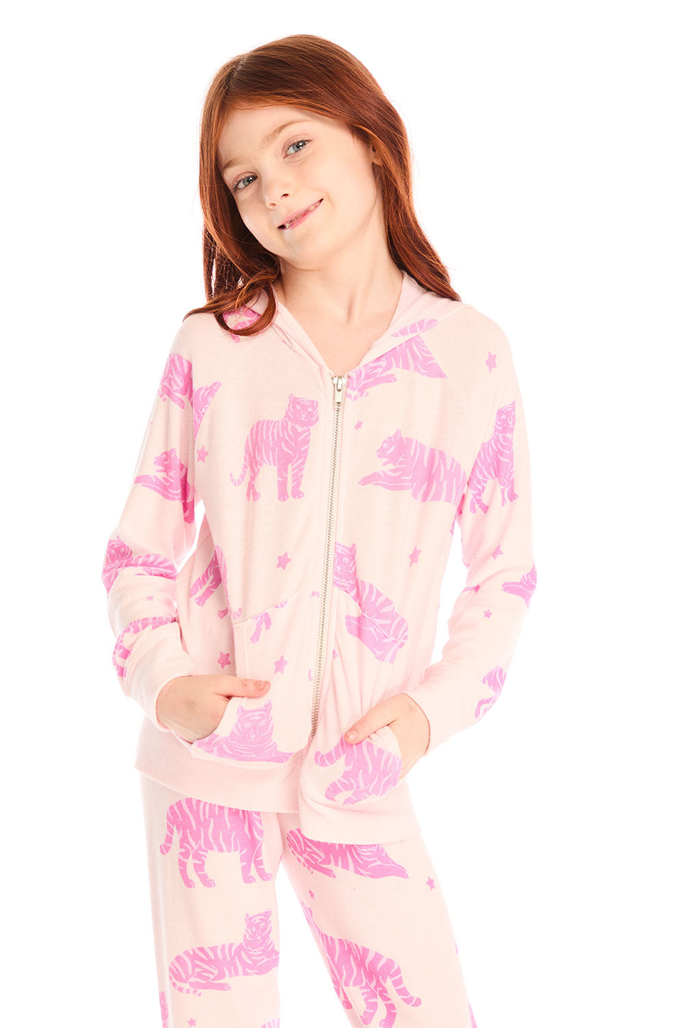 Girl wearing Chaser’s Celestial Tigers Zip Up Hoodie with pink animal pattern on a white background