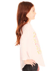 Side view of girl wearing Chaser’s light pink The Beatles Strawberry Fields Forever Long Sleeve with floral print on a white background
