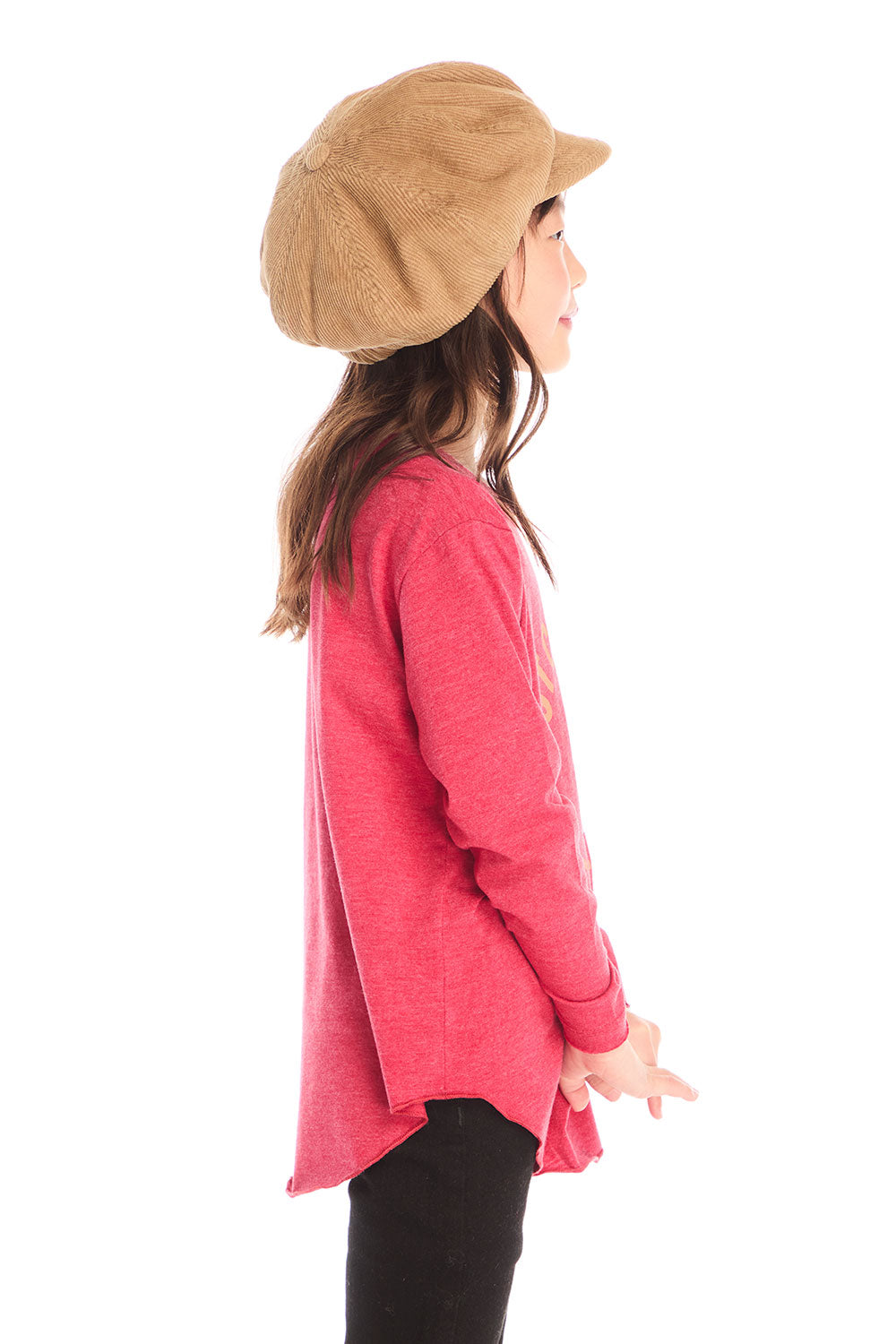 Side view of girl wearing Chaser’s red Hot Chocolate Weather Long Sleeve with a graphic design and black pants on a white background