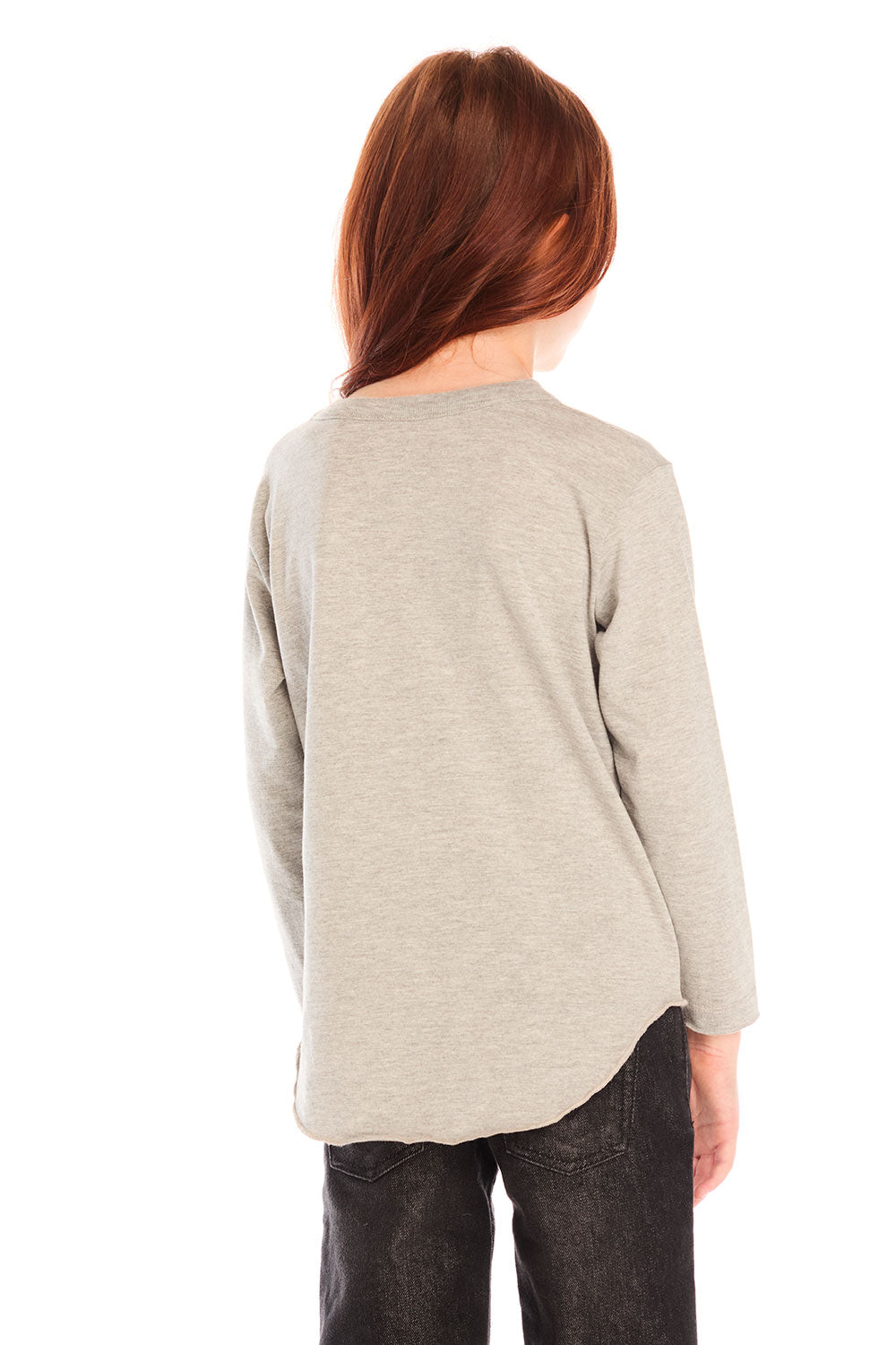 Back view of girl wearing Chaser’s Heather Grey Colorful Smileys long sleeve pullover and black jeans on a white background