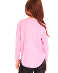 Back view of girl wearing Chaser’s pink Ski Ya Later Long Sleeve with text and graphics on a white background