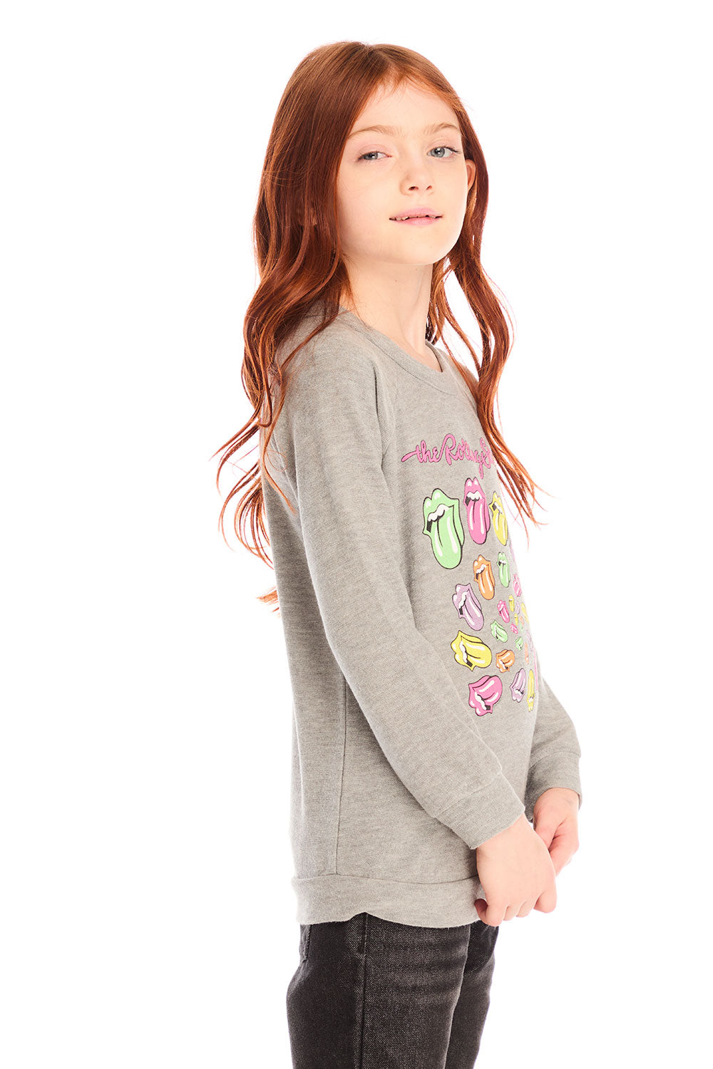 Side view of girl wearing Chaser’s gray The Rolling Stones Spiral Tongues Long Sleeve with colorful logo designs and text on a white background