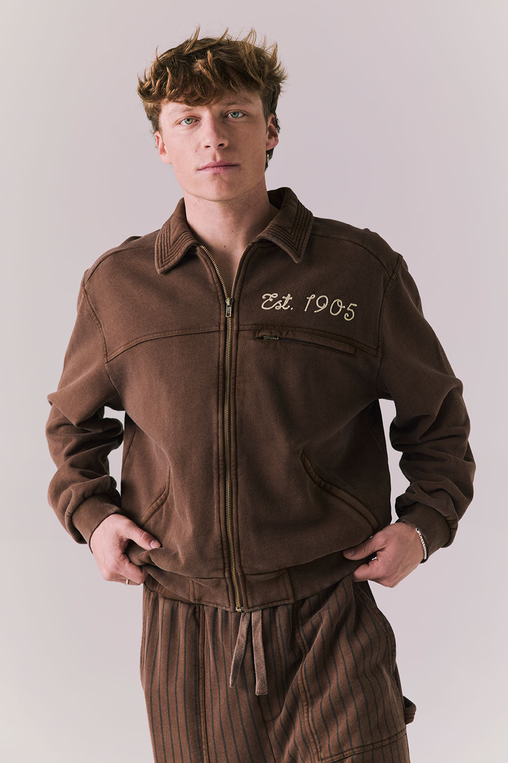 Front view of Est. 1905 Jacket in Kulaha Brown with varsity-style detailing.