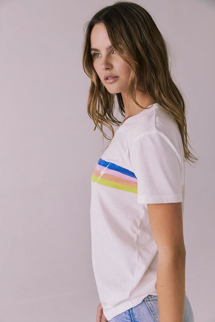 Side profile of the Retro Lightning Tee in White highlighting the stripe wrap and small lightning bolt at the sleeve