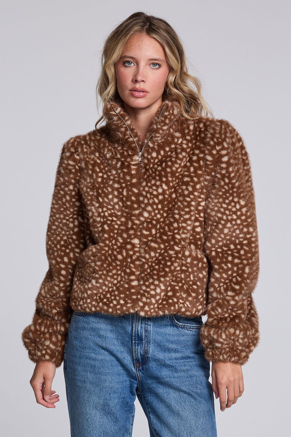 Model wearing Chaser's Baby Deer Puff Sleeve Jacket in warm brown spotted faux-fur texture with oversized puff sleeves, front view