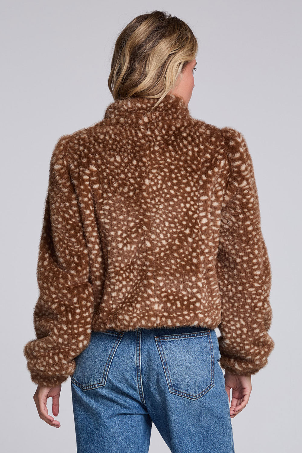 Model wearing Chaser's Baby Deer Puff Sleeve Jacket in warm brown spotted faux-fur texture with oversized puff sleeves, back view
