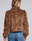 Model wearing Chaser's Baby Deer Puff Sleeve Jacket in warm brown spotted faux-fur texture with oversized puff sleeves, back view