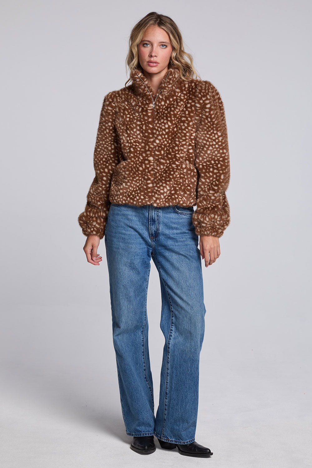 Model wearing Chaser's Baby Deer Puff Sleeve Jacket in warm brown spotted faux-fur texture with oversized puff sleeves, full-body view