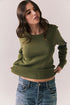 Front view of Varsity Star Sweater in bronze green with slouchy fit and twin arm stripes against a plain background