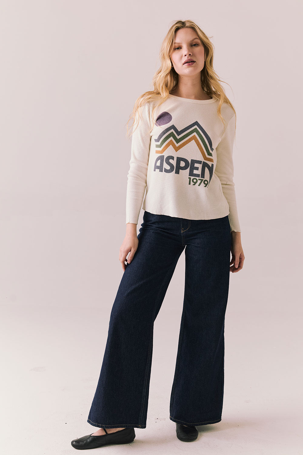 Full body view of model in Aspen 1979 Long Sleeve in white