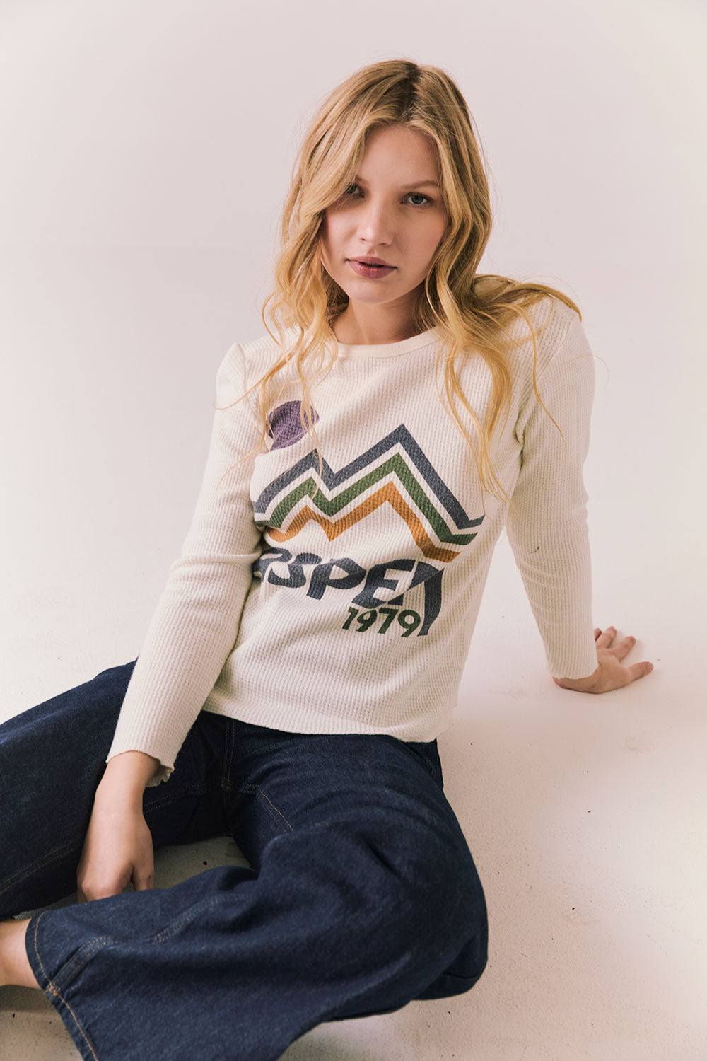 Full body view of model in Aspen 1979 Long Sleeve in white