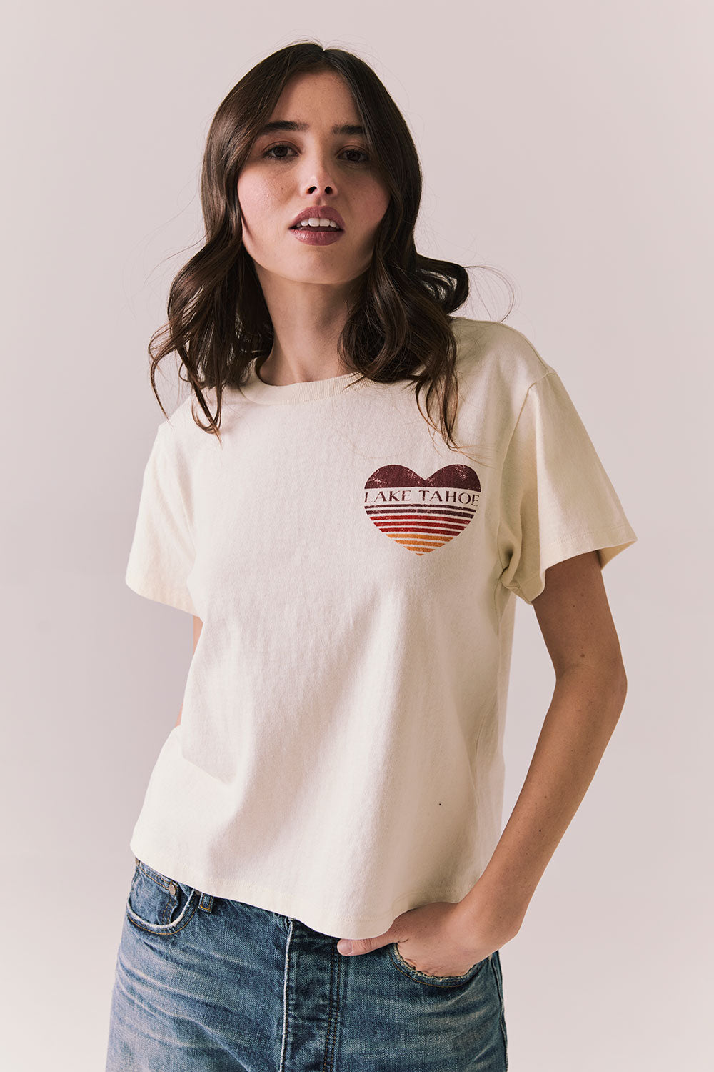 Front view of Lake Tahoe Ombre Tee in starry white with soft gradient fade, heart-shaped graphic design, and relaxed silhouette on a plain background