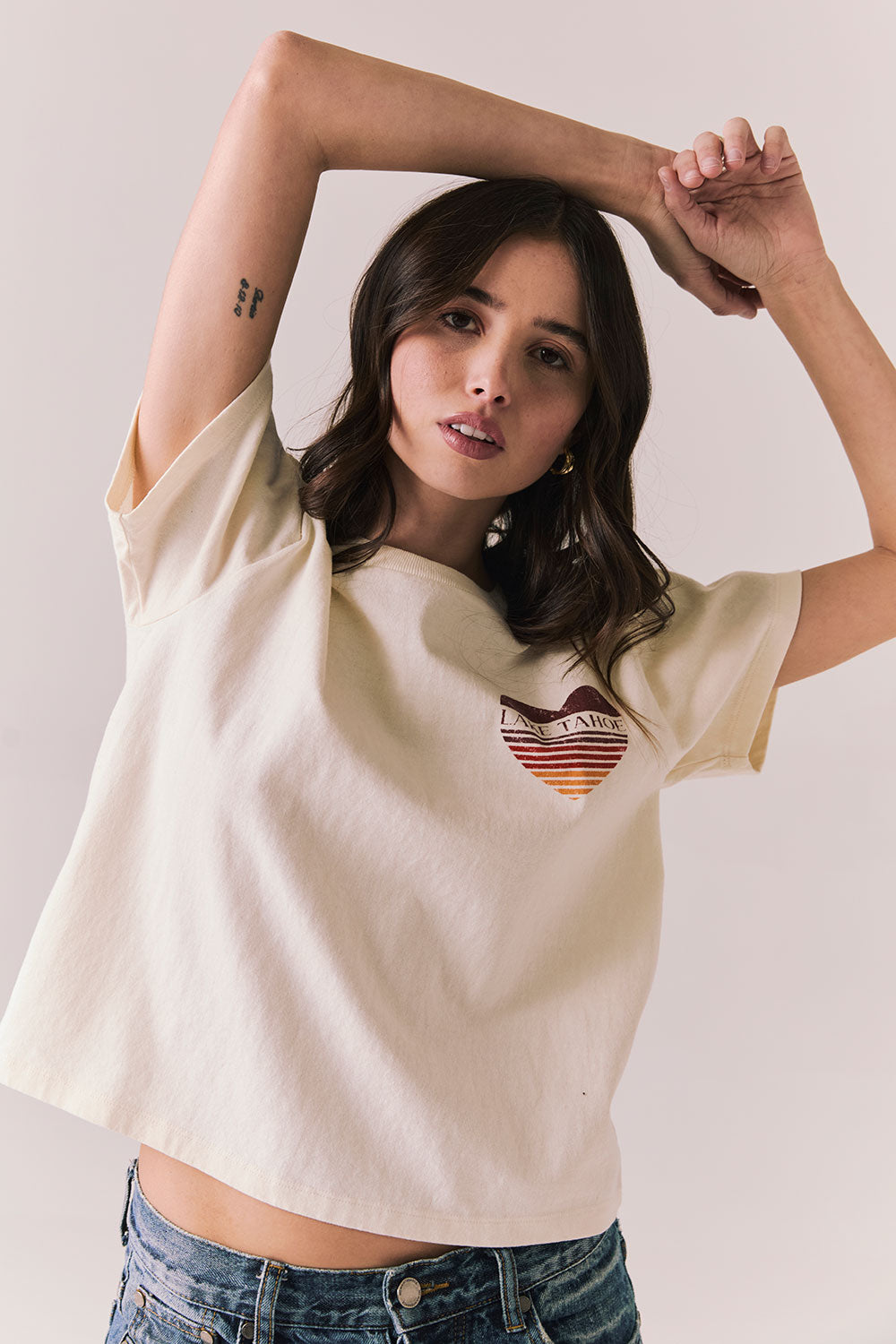 Front view of Lake Tahoe Ombre Tee in starry white with soft gradient fade, heart-shaped graphic design, and relaxed silhouette on a plain background